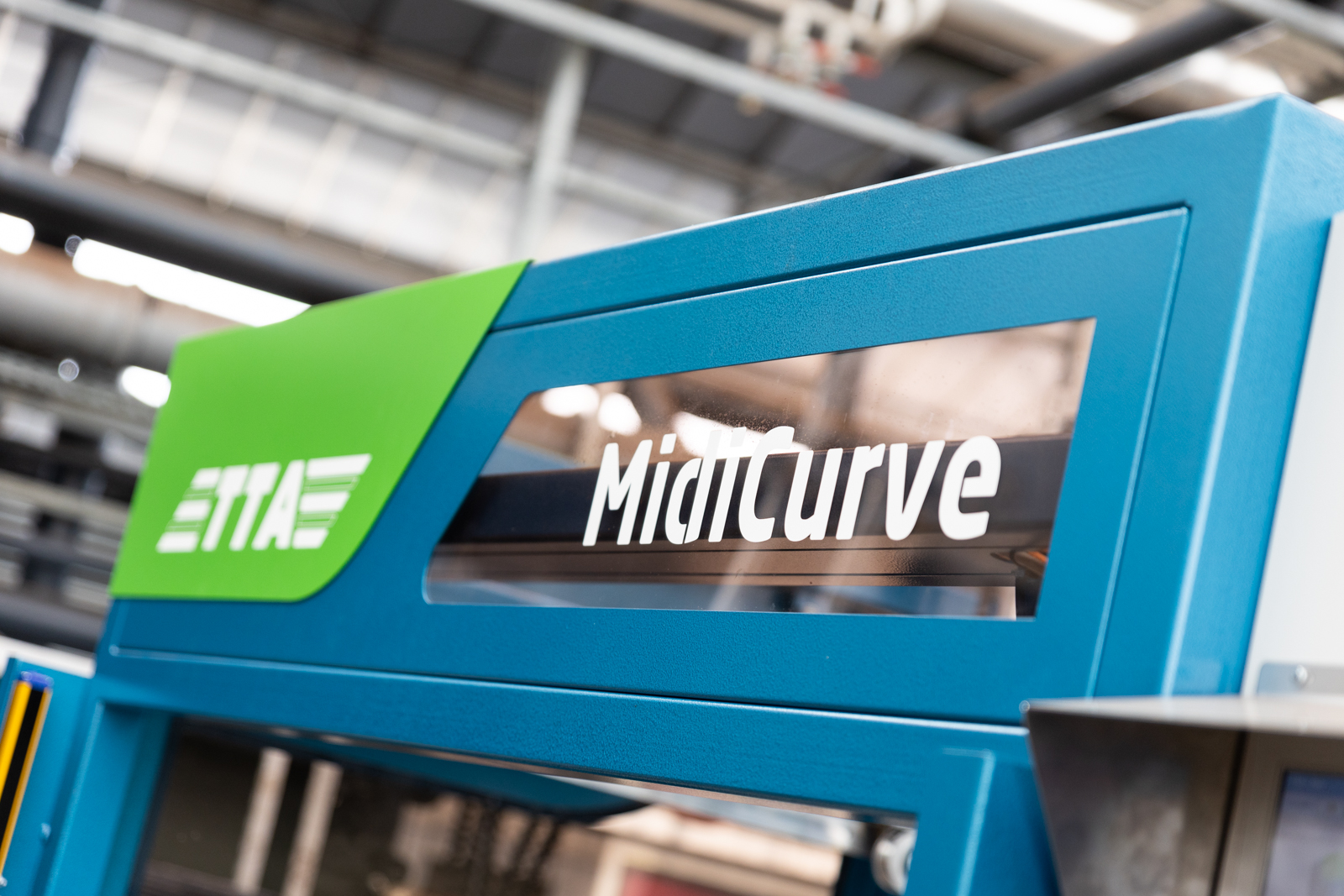 Maschinenname: MidiCurve, der Rundbehälter-Befüller von TTA-ISO